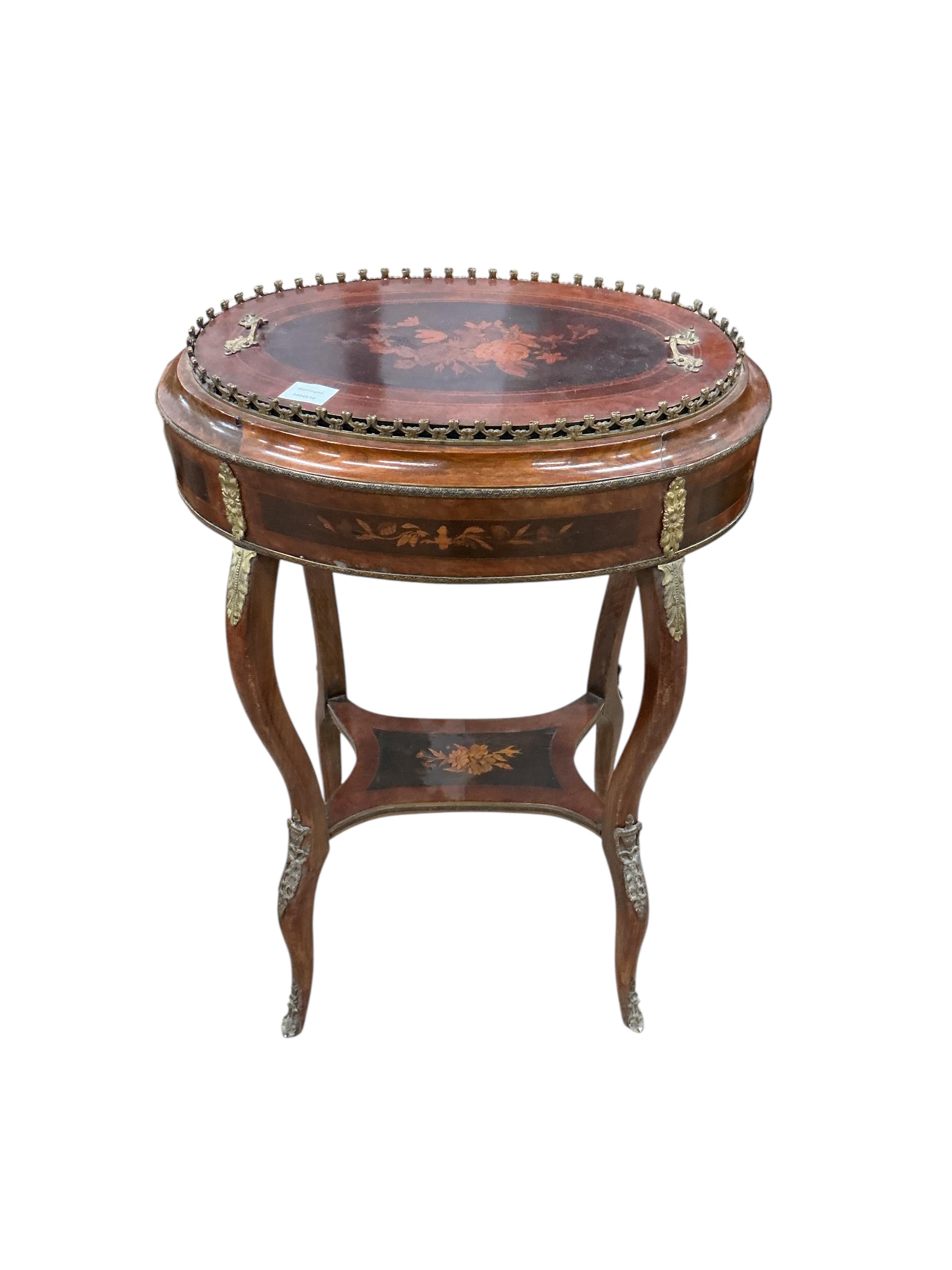 A French Louis XVI style oval gilt metal mounted marquetry inlaid walnut and beech jardiniere table, width 56cm, depth 38cm, height 80cm
